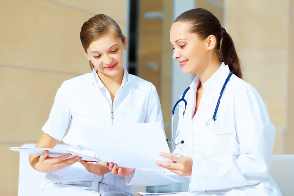 Portrait of two friendly female doctors Royalty Free Stock Images