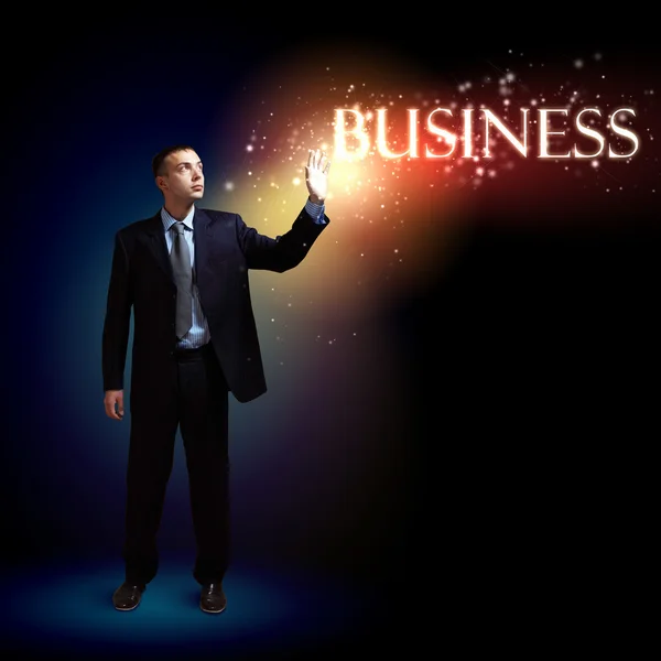 Businessman with light shining — Stock Photo, Image