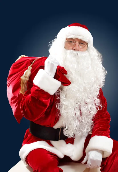 Babbo Natale con la sua borsa regalo — Foto Stock