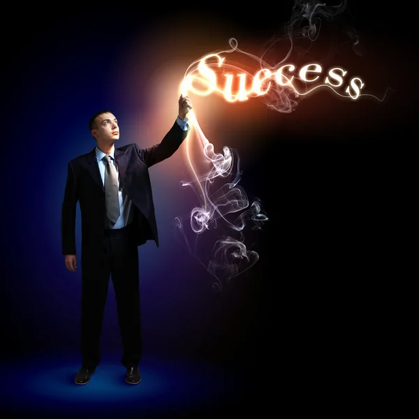 Businessman with light shining — Stock Photo, Image