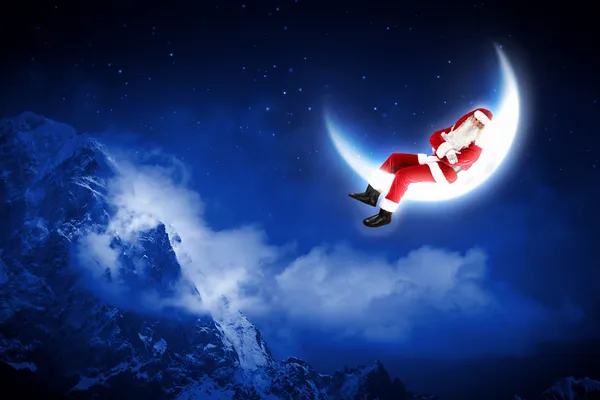 Ay'da oturup Noel Baba'nın fotoğraf — Stok fotoğraf