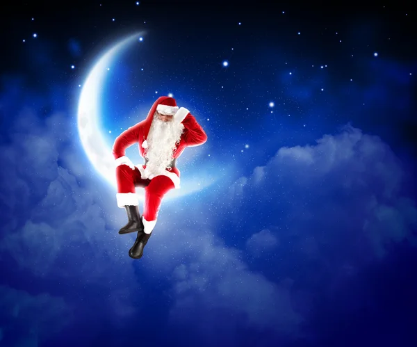 Zdjęcie santa Claus siedzi na Księżycu — Zdjęcie stockowe
