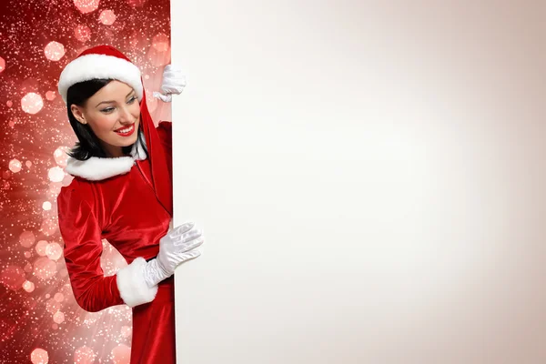 Santa girl with a blank banner — Stock Photo, Image