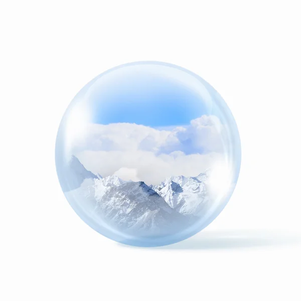 Snow mountains inside a glass ball — Stock Photo, Image