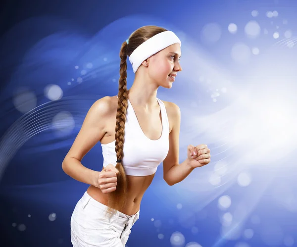 Young pretty woman in sport wear running — Stock Photo, Image