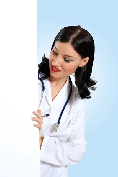 Young female doctor with a banner — Stock Photo, Image