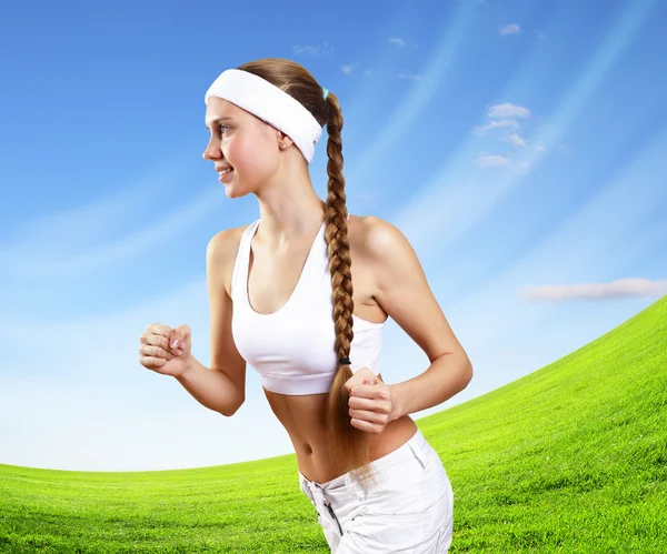 Young pretty woman in sport wear running — Stock Photo, Image