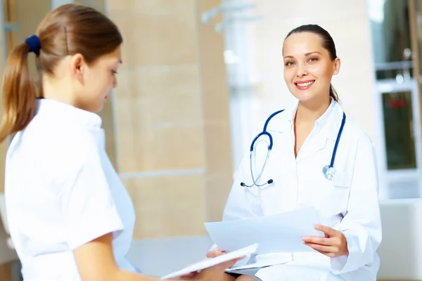 Portrait of two friendly female doctors — Stock Photo, Image