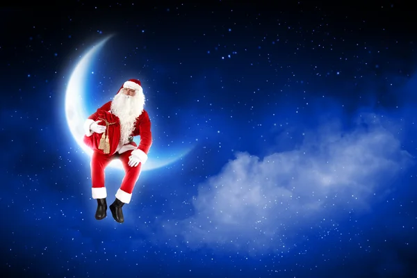 Photo du Père Noël assis sur la lune — Photo