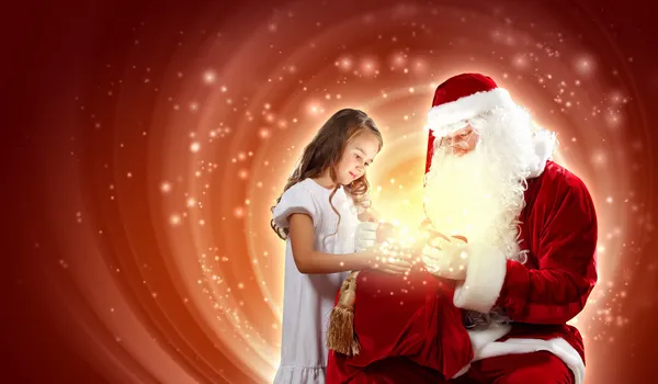 Ritratto di Babbo Natale con una ragazza — Foto Stock