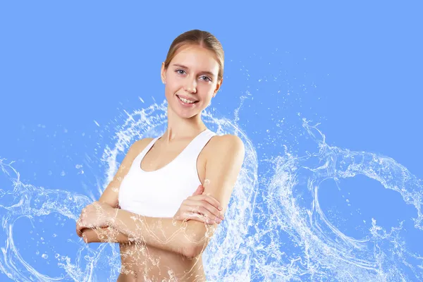 Sport vrouw tegen water spatten — Stockfoto