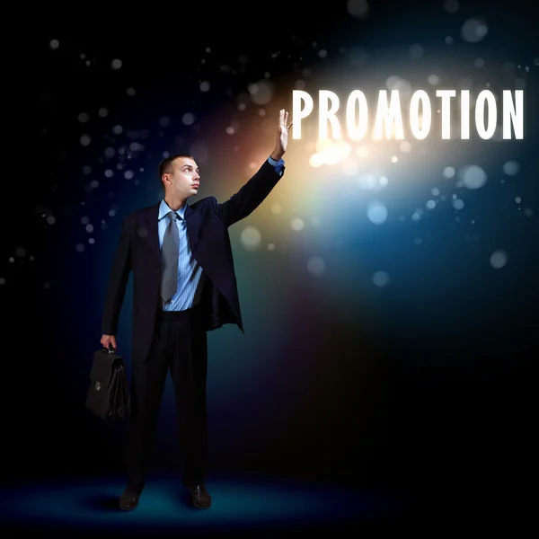 Businessman with light shining — Stock Photo, Image