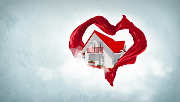 Casa withing um símbolo de coração — Fotografia de Stock