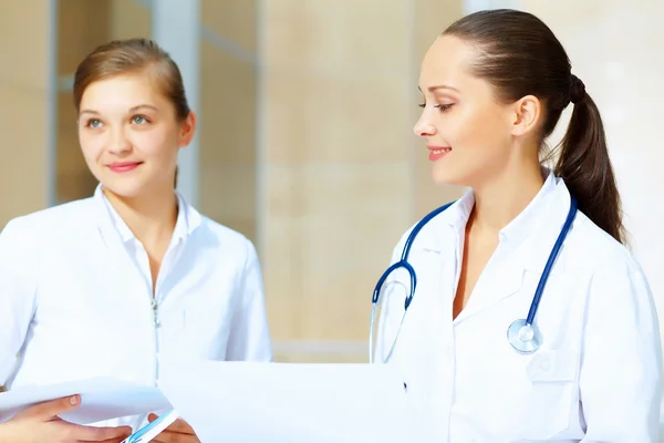 Portrait of two friendly female doctors Stock Image