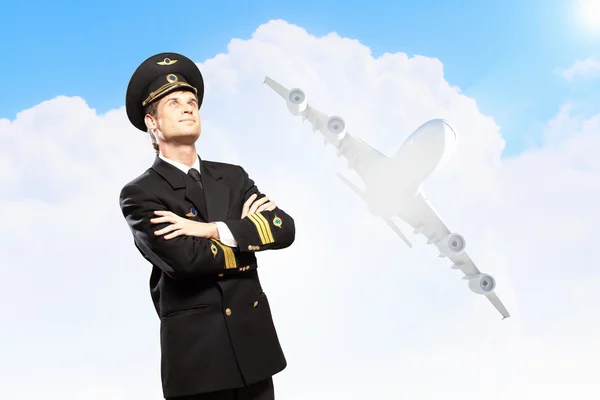 Image of male pilot with airplane at background — Stock Photo, Image