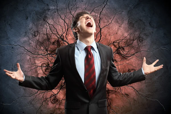 Businessman in anger with fists clenched screaming — Stock Photo, Image