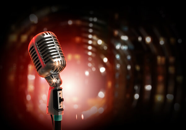 Retro microphone against colourful background