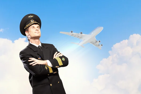 Image of male pilot with airplane at background — Stock Photo, Image