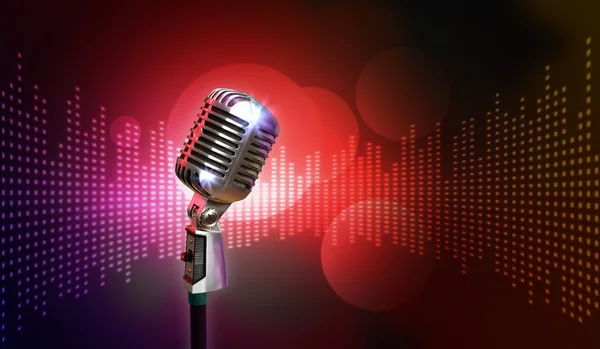 Retro microphone against colourful background — Stock Photo, Image