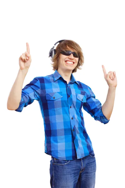 Feliz joven sonriente bailando y escuchando música —  Fotos de Stock