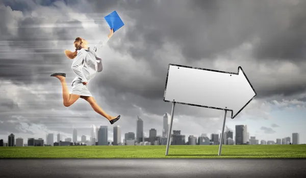 Businesswoman running on the road — Stock Photo, Image