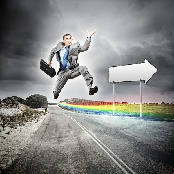 Businessman running on the road — Stock Photo, Image