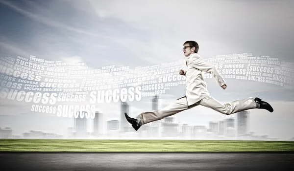 Businessman running on the road — Stock Photo, Image