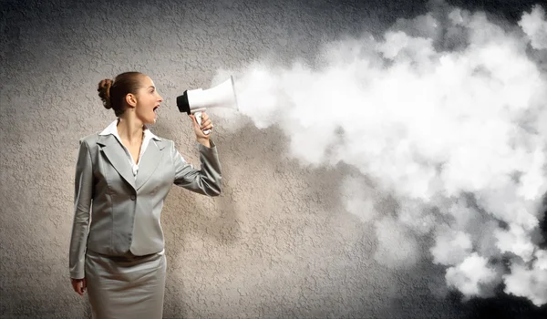 Businesswoman with megaphone — Stock Photo, Image