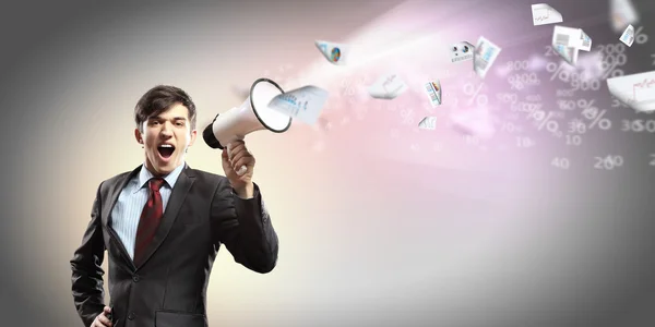 Businessman with megaphone — Stock Photo, Image