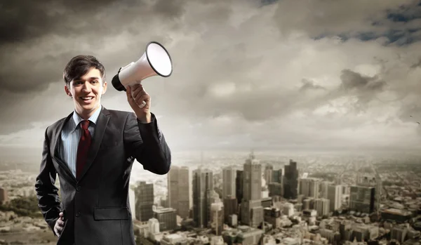 Businessman with megaphone — Stock Photo, Image