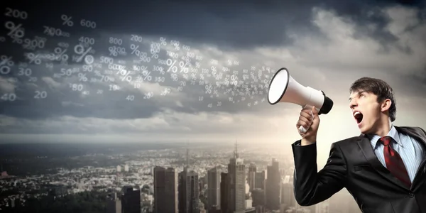 Businessman with megaphone — Stock Photo, Image