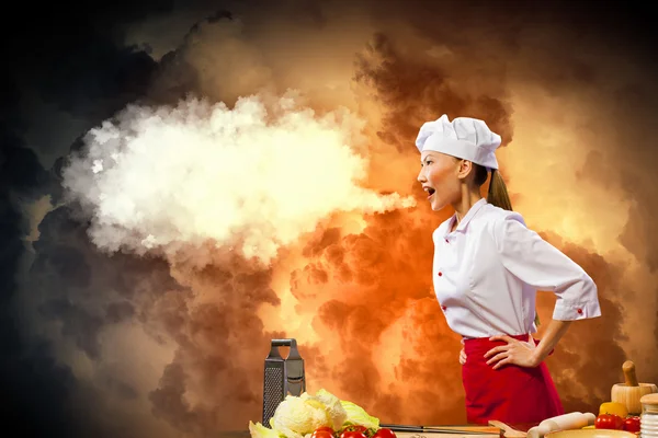 Asian female cook in anger — Stock Photo, Image