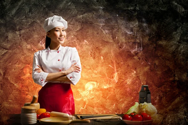 Asian female cook in anger — Stock Photo, Image