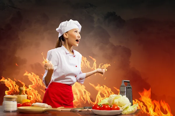 Asian female cook in anger — Stock Photo, Image