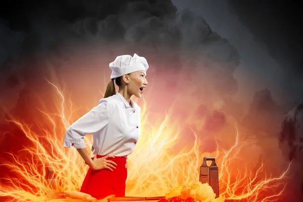 Asian female cook in anger — Stock Photo, Image