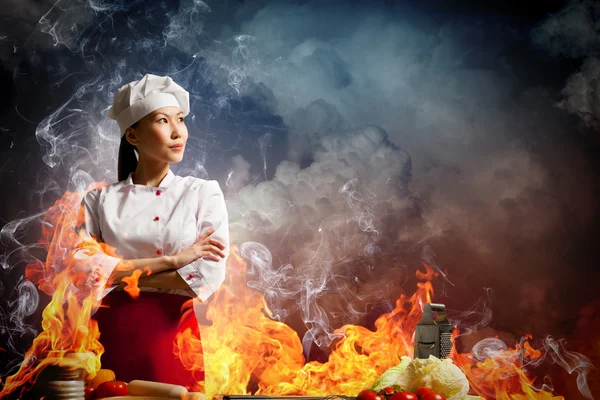 Asian female cook in anger — Stock Photo, Image