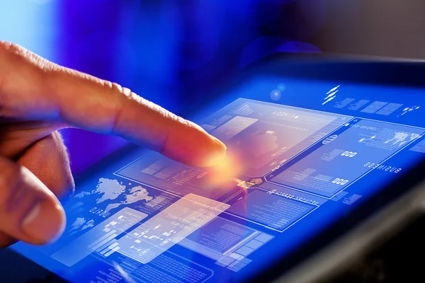 Closeup of finger touching tablet-pc screen — Stock Photo, Image