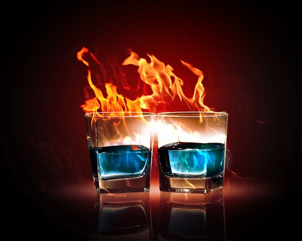 Two glasses of burning emerald absinthe — Stock Photo, Image