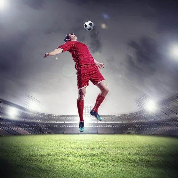 Football player striking the ball Stock Image