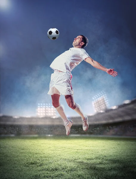 Football player striking the ball Stock Picture