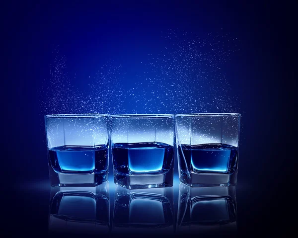 Three glasses of blue liquid — Stock Photo, Image