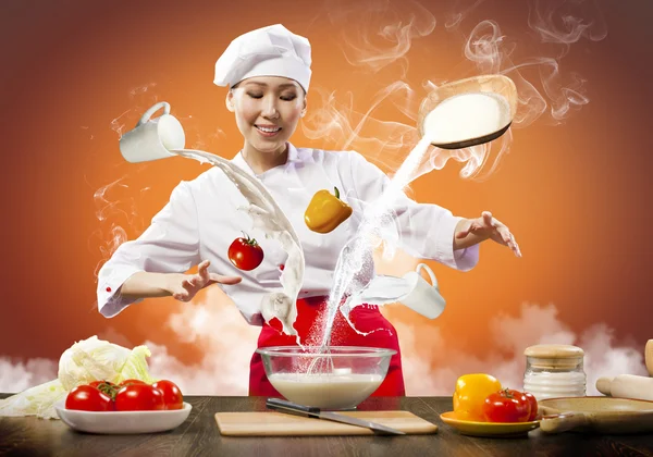 Asiatico femmina cucina con magia — Foto Stock