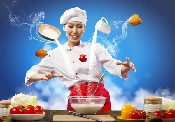 Asiatico femmina cucina con magia — Foto Stock