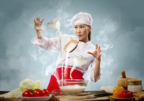 Cocina femenina asiática con magia —  Fotos de Stock