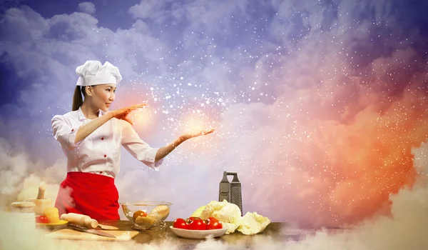 Asiatico femmina cucina con magia — Foto Stock