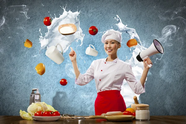 Asian female cook holding megaphone — Stock Photo, Image