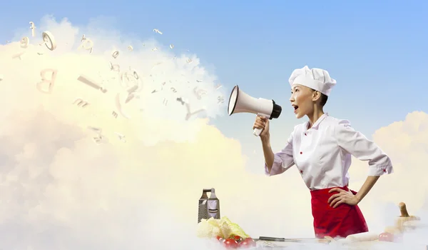 Asian female cook holding megaphone — Stock Photo, Image