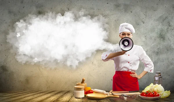 Asian female cook holding megaphone — Stock Photo, Image