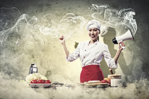 Asian female cook holding megaphone — Stock Photo, Image