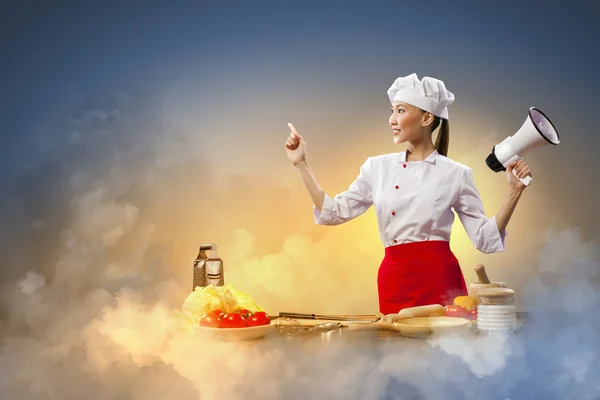 Asian female cook holding megaphone — Stock Photo, Image